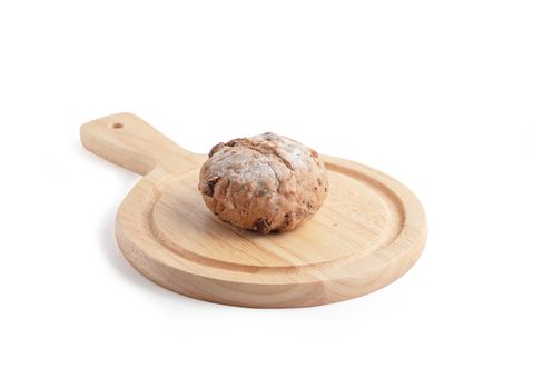 Homemade buns on the cutting board isolated on the white background with clipping paths. Bread is a food made from wheat flour mixed with water and yeast or baking powder.