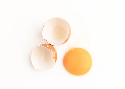 Raw chicken egg and yolks isolated on the white background