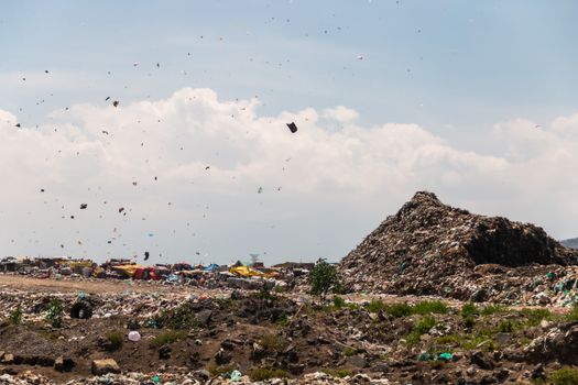 A huge landfill for waste disposal. Accumulation of garbage in landfill or deposit. Pollution concept.