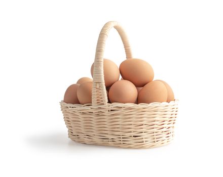 Eggs in the wooden basket on the white background with clipping paths