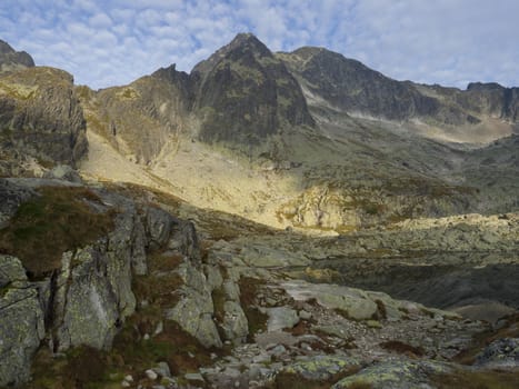 view on mountain lake Prostredne Spisske pleso at the end of the hiking route to the Teryho Chata mountain shelter in the High Tatras in Slovakia.