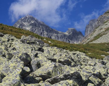 View on mountain Peak Lomnicky stit 2 634 m covered in clouds at Summer, one of the highest mountain peaks in the High Tatras mountains of Slovakia Vysoke Tatry.