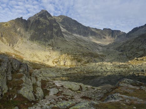 view on mountain lake Prostredne Spisske pleso at the end of the hiking route to the Teryho Chata mountain shelter in the High Tatras in Slovakia.