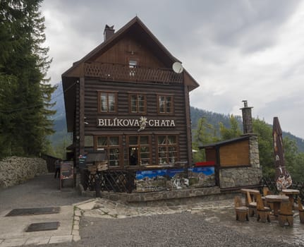 Slovakia, High Tatra mountain, Stary Smokovec, Hrebienok, September 14, 2018: Front view on Mountain Hotel Bilikova Chata, wooden cottage, moody sky