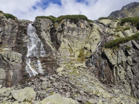Skok waterfall High Tatras mountain, summer sunny day, Strbske Pleso, Slovakia.