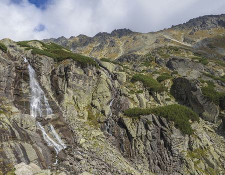 Skok waterfall High Tatras mountain, summer sunny day, Strbske Pleso, Slovakia.