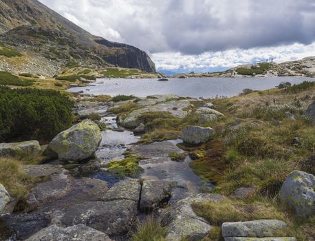 Pleso nad Skokom, beautiful mountain lake in Mlynicka Dolina Valley with wild river stream, High Tatras mountain, Vysoke Tatry, Slovakia.