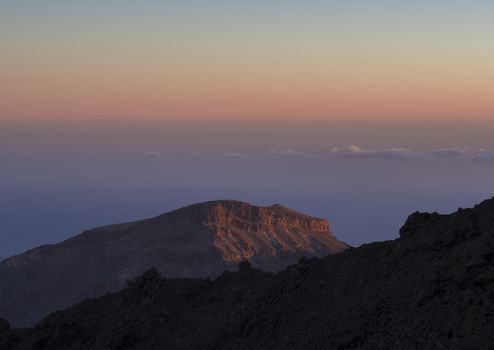 pink colorful sunset with view on red mountain in tenerife national el teide park