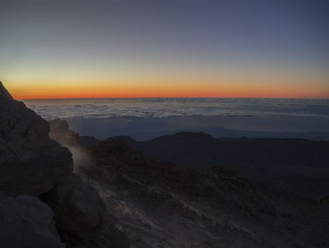 red glow before sunrise on the top of pico del teide  vulcano highest spanish mountain on tenerife canary island