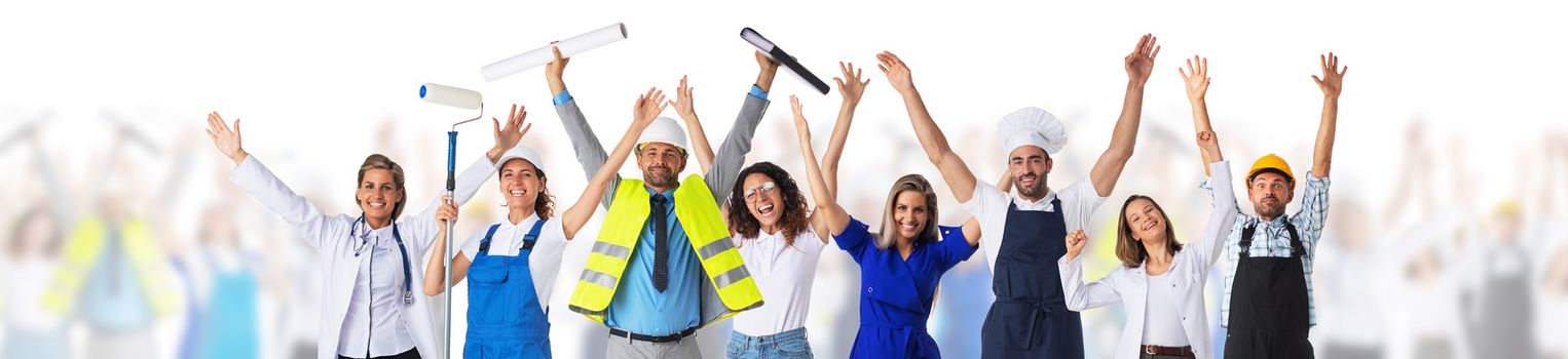 Group of happy people with arms raised representing diverse professions over defocused crowd of people, isolated on white background