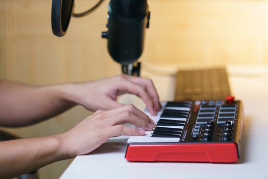 Hand using sound mixing console board. Equipment for the music studio.