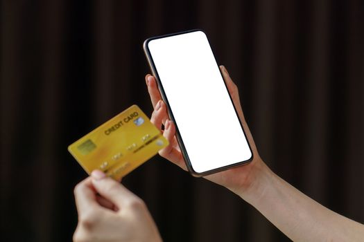 Online payment woman makes an online shopping by credit card payment on mobile smart phone.