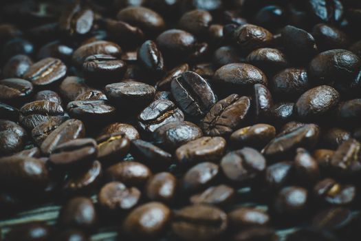 Coffee beans. On a wooden background.