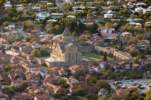 Mtskheta, Georgia, seen from Jvari Monastery with low sun, very beautiful, golden yellow with The Svetitskhoveli Cathedral