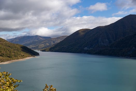 Zhinvali Dam, beautiful lakes with hills and islands, blue sky and clouds. In eastern Georgia located in Dusheti municipality. North to the village Zhinvali. On the Georgian Military Highway. The Soviets constructed the dam in the 1980