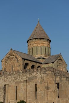 The Svetitskhoveli Cathedral, Mtskheta Georgia 05/10/2019 Exterior from market place in late soft golden sun