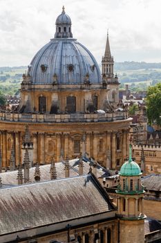 Oxford city skyline with Radcliffe Camera in foreground, unusual view with the countryside of Boars Hill in the background. Showing the Dreaming Spires of the city centre and the location in the greater landscape. 