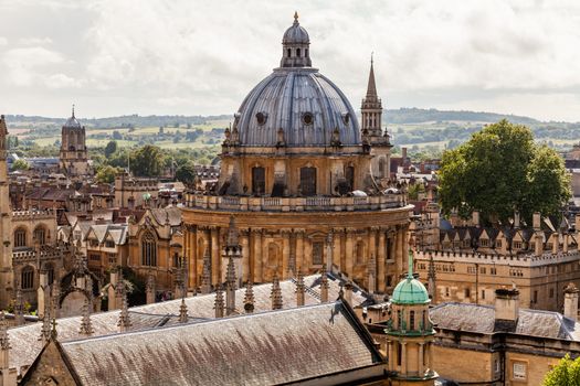 Oxford city skyline with Radcliffe Camera in foreground, unusual view with the countryside of Boars Hill in the background. Showing the Dreaming Spires of the city centre and the location in the greater landscape. 