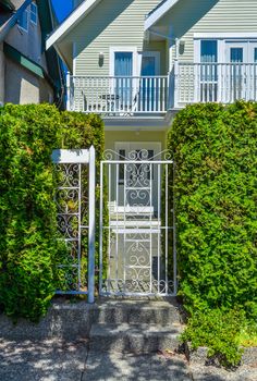 Decorated metal gate of residential house entrance