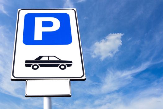 Parking sign with blue sky background on sunny day