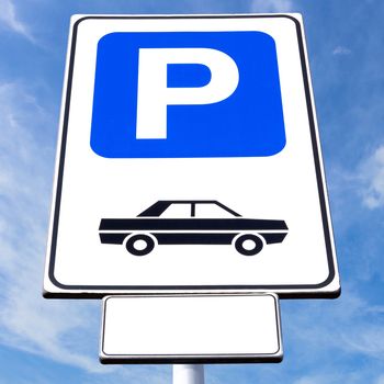 Parking sign with blue sky background on sunny day