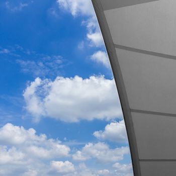 Detail of tensile shading roof against blue sky