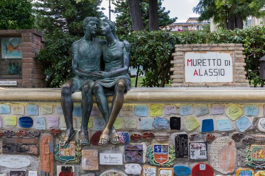 Alassio (SV), ITALY - August 22, 2017: "Muretto di Alassio", the famous Little Wall in Alassio with the bronze statue of the lovers.