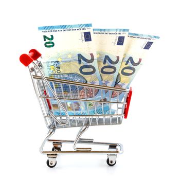 Isolated shopping cart with euro banknotes