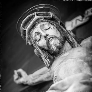 Nailed hand on wooden cross. Crucifixion of Jesus Christ.