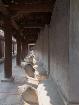 Temple of Literature, Hanoi Vietnam, famous museum that tourists visit with beautiful gardens old trees. Built as a university in 1070 dedicated to Confucius, scholars and sages and houses with stelae mounted on the backs of stone turtles. High quality photo