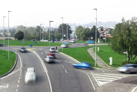 Traffic in the city, jam, flowing with blurred motion.
