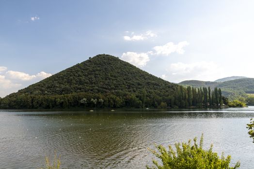 piediluco lake and its island in the center on a sunny day