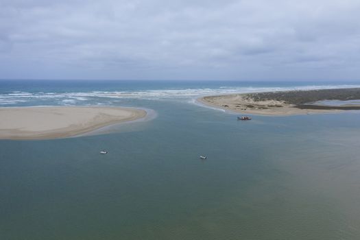 Aerial view of a sand dredger boat at the mouth of the Murray River in South Australia