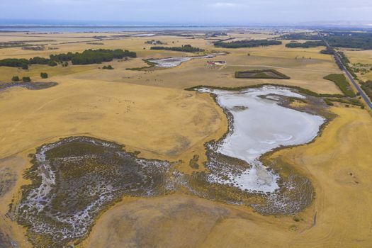 Aerial view of an irrigation dam affected by severe drought in regional Australia