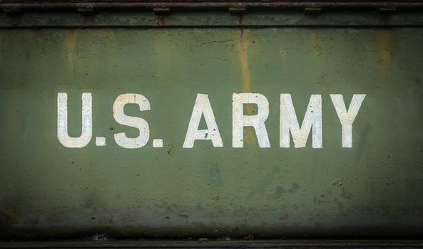 Vintage Sign For The US Army On The Side Of An Old Truck Or Tank