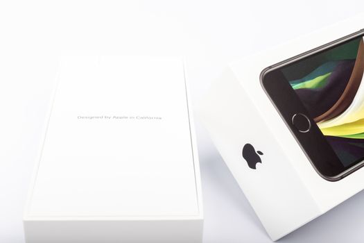 Paris, France - May 14, 2020: packaging of the new black iPhone SE 2020 from the multinational company Apple during the days of its studio release on a white background