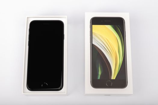 Paris, France - May 14, 2020: packaging of the new black iPhone SE 2020 from the multinational company Apple during the days of its studio release on a white background