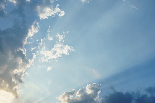 Blue sky with clouds and sun light.