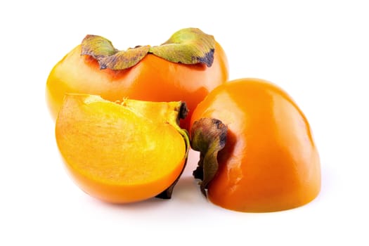 fresh persimmons and persimmon slice with leaf isolated on white background.