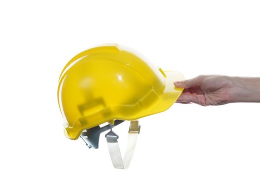 Woman hand holding yellow safety helmet isolated on white background.