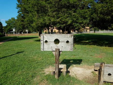 wooden stock punishment device and grass or field