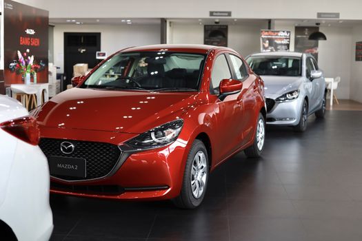 BANGSAEN,THAILAND 2020, car all new MAZDA3 MAZDA2 2020 brand japan red  color on room customer dealership in garage parked in showroom of thailand for transport Illustrative editorial image.