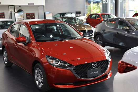 BANGSAEN,THAILAND 2020, car all new MAZDA3 MAZDA2 2020 brand japan red  color on room customer dealership in garage parked in showroom of thailand for transport Illustrative editorial image.