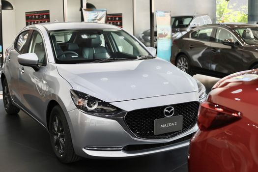 BANGSAEN,THAILAND 2020, car all new MAZDA3 MAZDA2 2020 brand japan red  color on room customer dealership in garage parked in showroom of thailand for transport Illustrative editorial image.