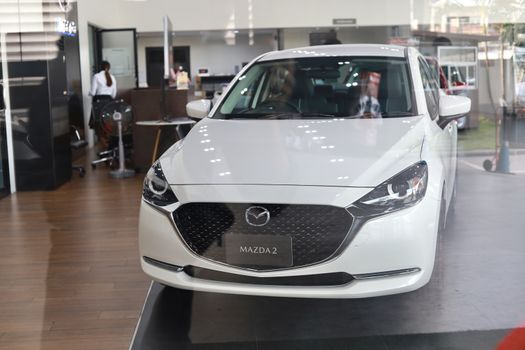 BANGSAEN,THAILAND 2020, car all new MAZDA3 MAZDA2 2020 brand japan red  color on room customer dealership in garage parked in showroom of thailand for transport Illustrative editorial image.