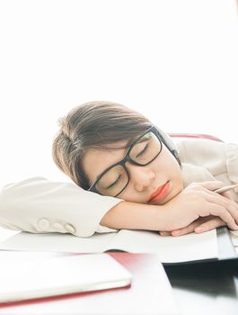 Teenage girl short hair sleep on desk after working on laptop while sit near window at home office