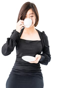 Young woman sittng holding coffee cup on white background