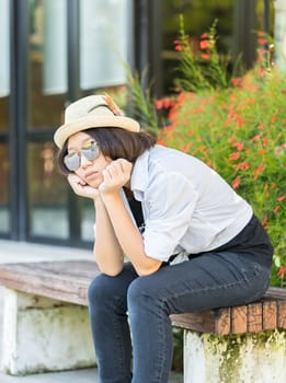 Beautiful and young women with short hair wearing hat in park