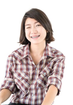 Young pretty woman in plaid shirt posing in studio with isolated on white background