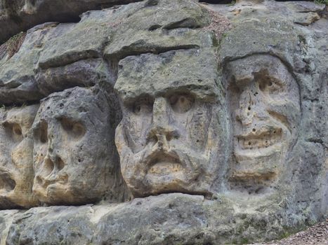big heads sculpted in 1846 by Vaclav Levy to the sand stone rock in Zelizy, czech republic